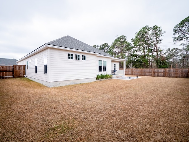 rear view of property featuring a patio area