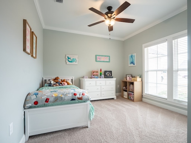 bedroom featuring crown molding, carpet floors, and ceiling fan