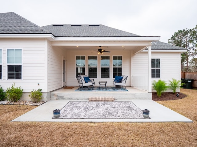 back of house with a yard, a patio, and ceiling fan