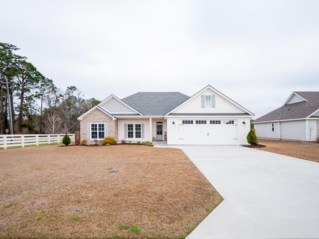 view of front facade featuring a garage and a front yard