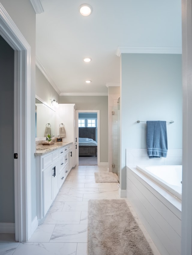 bathroom featuring ornamental molding, vanity, and separate shower and tub