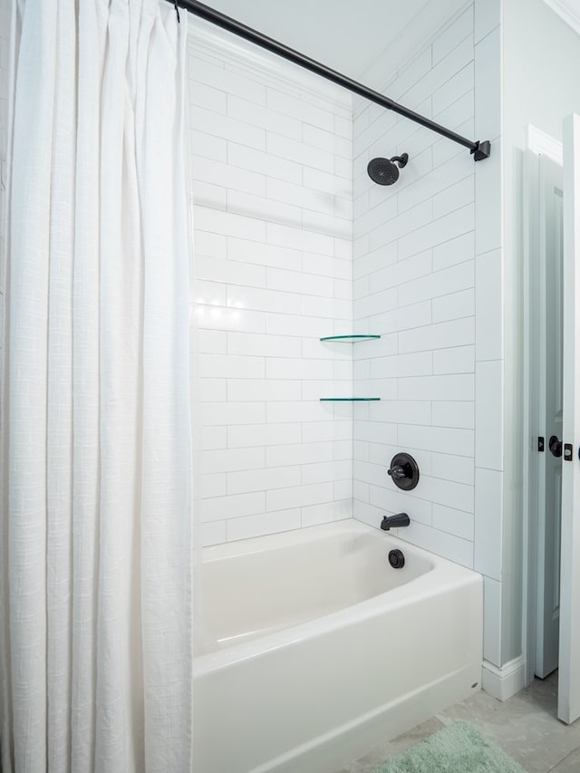 bathroom with shower / tub combo with curtain