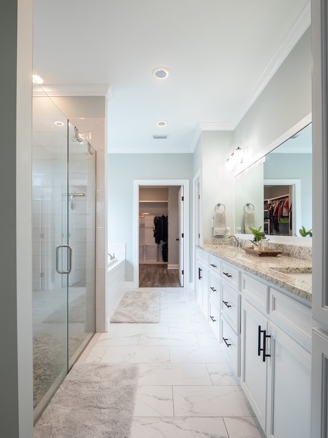 bathroom with independent shower and bath, crown molding, and vanity