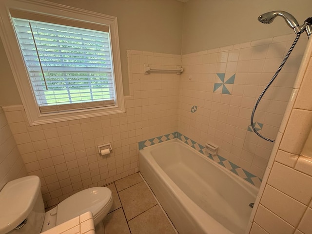 208 Magnolia Dr, Adel, GA 31620 - full bathroom with tile patterned flooring, tile walls, a tub to relax in, and a shower