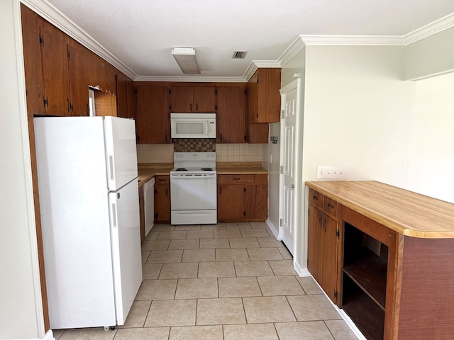 208 Magnolia Dr, Adel, GA 31620 - kitchen featuring white appliances, light tile patterned floors, light countertops, decorative backsplash, and ornamental molding