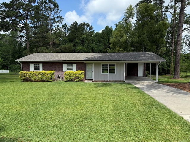 208 Magnolia Dr, Adel, GA 31620 - ranch-style house with concrete driveway, an attached carport, and a front lawn