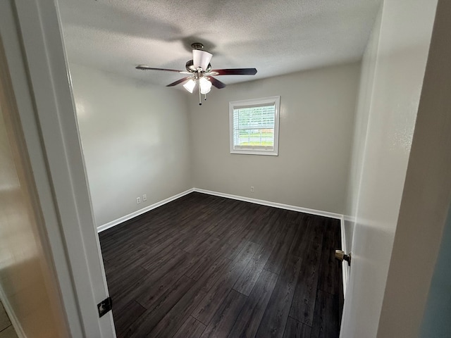 208 Magnolia Dr, Adel, GA 31620 - unfurnished room featuring ceiling fan, dark wood-style flooring, and a textured ceiling
