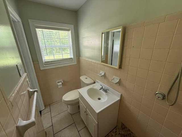 208 Magnolia Dr, Adel, GA 31620 - bathroom with tile walls, tile patterned flooring, vanity, and wainscoting