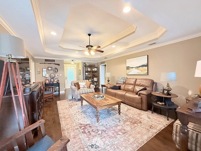 4172 Bright Crk, Hahira, GA 31632 - living area with dark wood-type flooring, a raised ceiling, ornamental molding, and ceiling fan