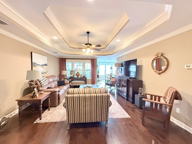 4172 Bright Crk, Hahira, GA 31632 - living room featuring a raised ceiling, ornamental molding, dark wood-style floors, and ceiling fan