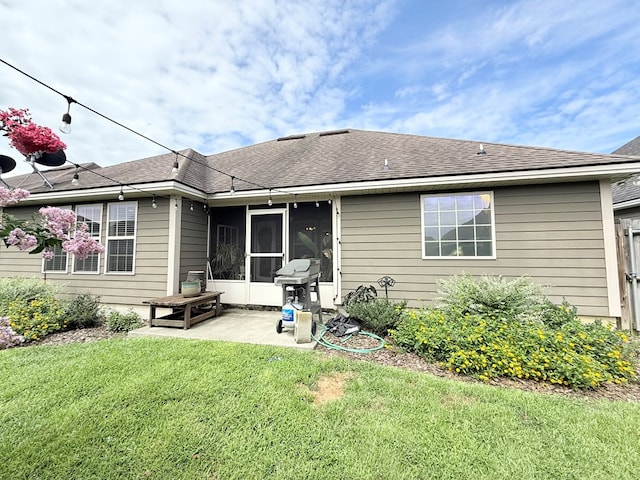 4172 Bright Crk, Hahira, GA 31632 - back of house featuring a patio, a lawn, a sunroom, and roof with shingles