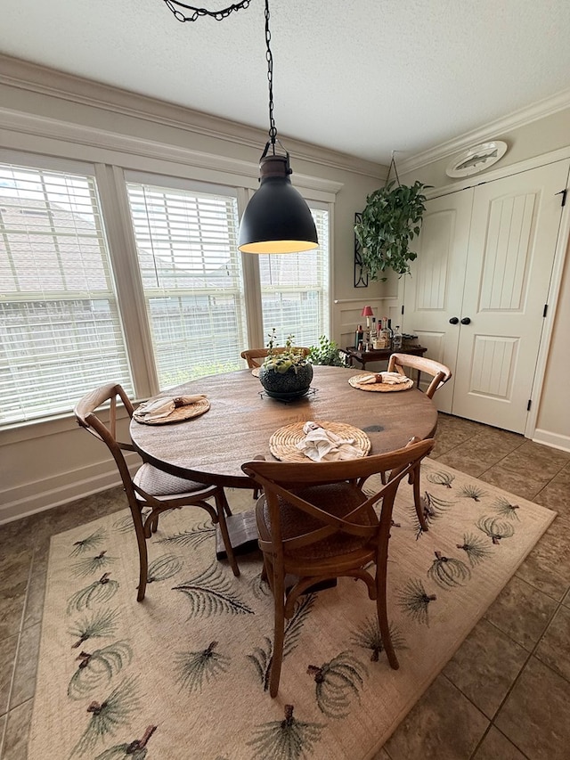 4172 Bright Crk, Hahira, GA 31632 - tiled dining space featuring crown molding and a textured ceiling
