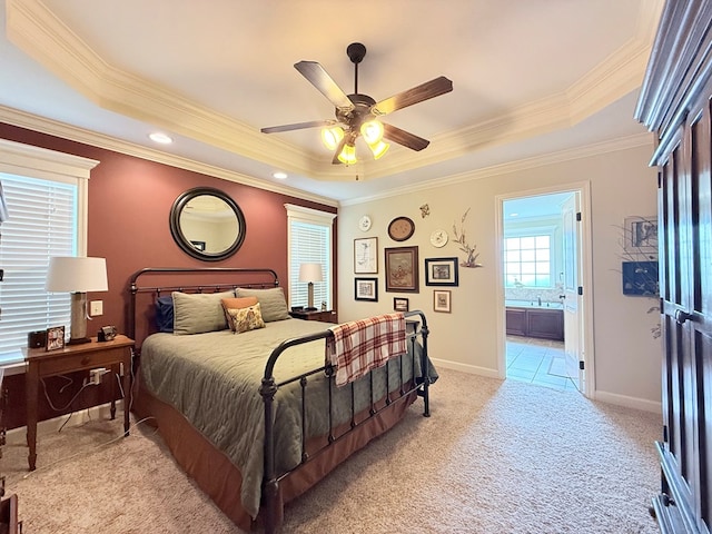 4172 Bright Crk, Hahira, GA 31632 - bedroom featuring a tray ceiling, light carpet, ornamental molding, connected bathroom, and ceiling fan