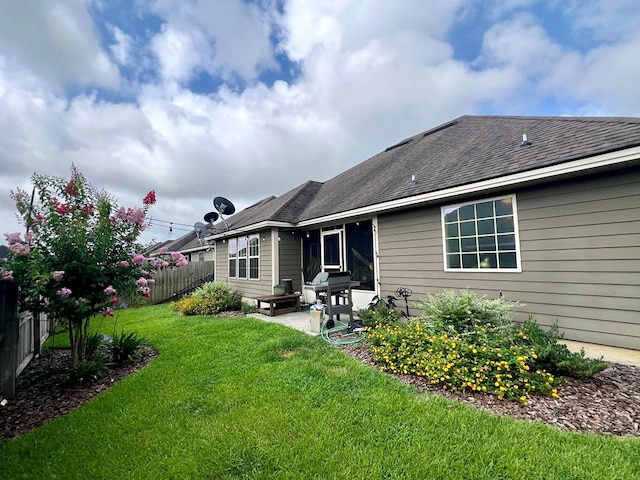 4172 Bright Crk, Hahira, GA 31632 - back of house featuring a patio area and roof with shingles
