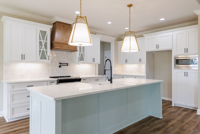 3061 Houser Way, Hahira, GA 31632 - kitchen featuring stainless steel microwave, electric range, white cabinetry, ornamental molding, and recessed lighting