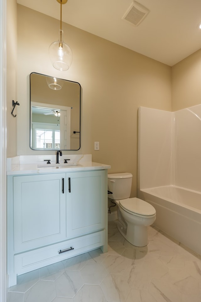 3061 Houser Way, Hahira, GA 31632 - bathroom with toilet, vanity, ceiling fan, shower / bath combination, and marble finish flooring