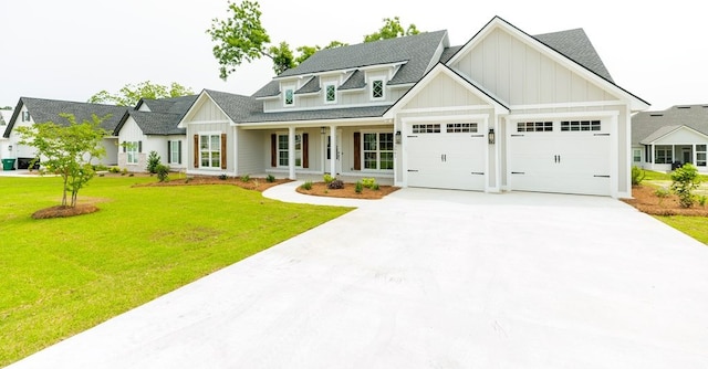 3061 Houser Way, Hahira, GA 31632 - view of front of house with board and batten siding, concrete driveway, roof with shingles, a front yard, and an attached garage