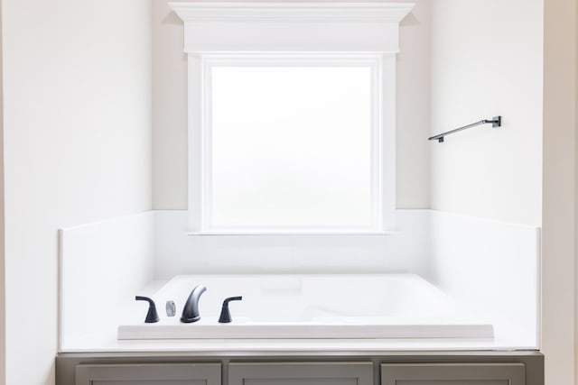 3061 Houser Way, Hahira, GA 31632 - full bathroom featuring a garden tub and healthy amount of natural light
