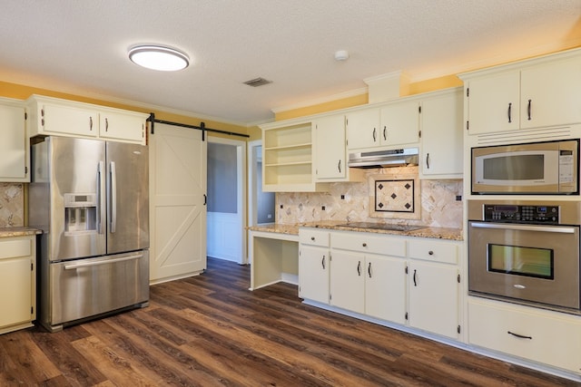 kitchen with dark wood-style floors, open shelves, ornamental molding, under cabinet range hood, and appliances with stainless steel finishes