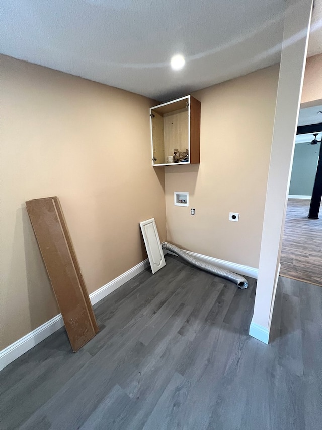 clothes washing area featuring baseboards, electric dryer hookup, washer hookup, and dark wood-style floors
