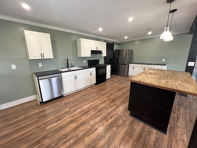 kitchen featuring fridge with ice dispenser, electric range, under cabinet range hood, dishwasher, and a sink