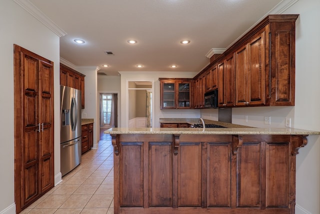 kitchen with stainless steel fridge, kitchen peninsula, ornamental molding, and light tile patterned floors