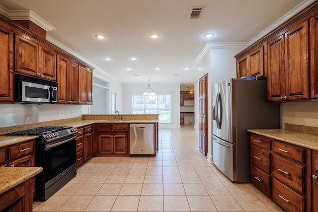 kitchen with appliances with stainless steel finishes, crown molding, sink, a chandelier, and light tile patterned flooring