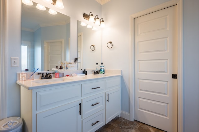 bathroom featuring vanity and ornamental molding