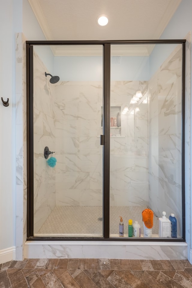 bathroom featuring walk in shower and crown molding