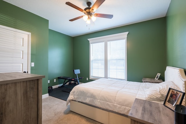 carpeted bedroom featuring ceiling fan