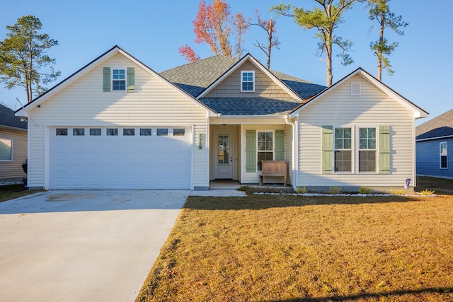 view of front facade featuring a front lawn, a porch, and a garage