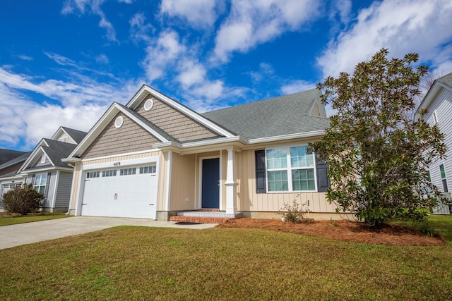 view of front of home with a garage and a front yard