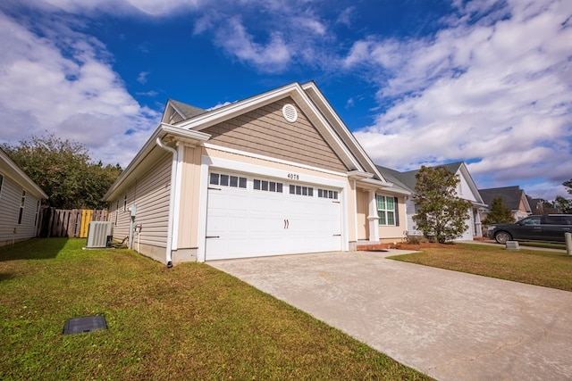 view of front of home featuring cooling unit, a garage, and a front yard