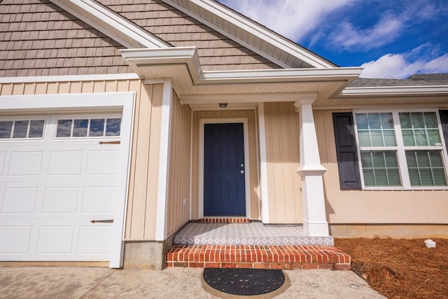 doorway to property featuring a garage