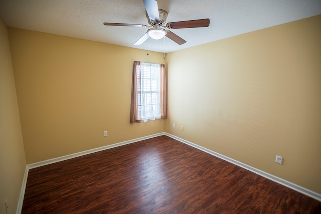 empty room featuring ceiling fan, hardwood / wood-style floors, and a textured ceiling