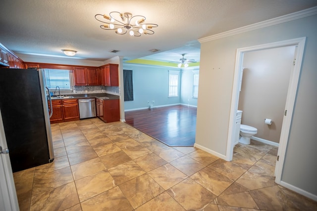 kitchen featuring backsplash, stainless steel appliances, sink, and a wealth of natural light