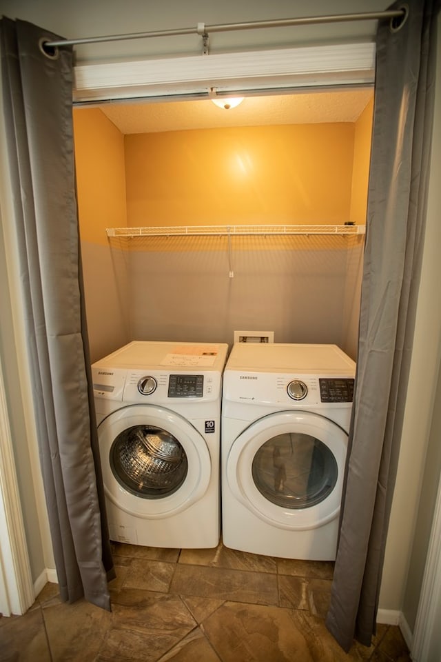 washroom with washing machine and dryer