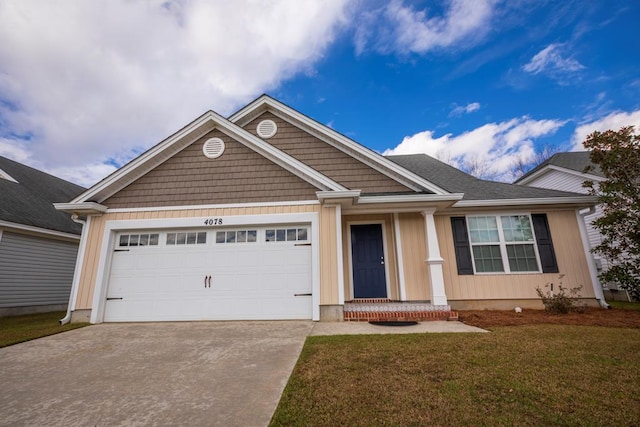 view of front of house with a garage and a front yard