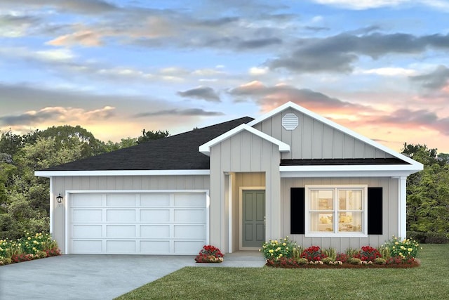 view of front facade featuring a lawn and a garage