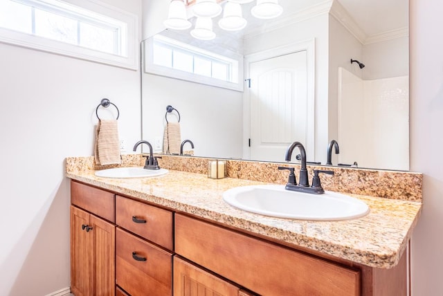 bathroom with vanity, a wealth of natural light, and ornamental molding