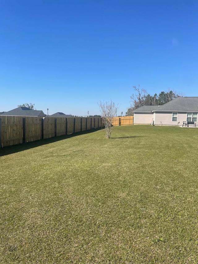 view of yard with fence