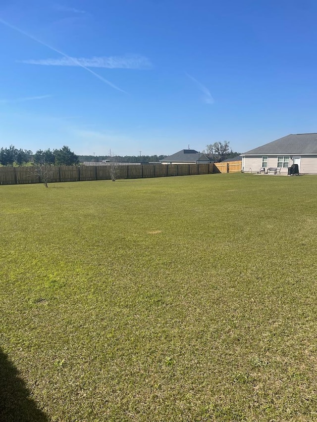 view of yard featuring fence