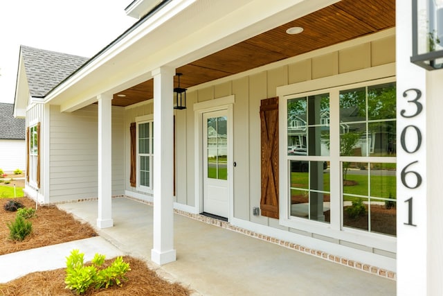 4856 Brown Cat Cir, Hahira, GA 31632 - view of exterior entry featuring a shingled roof and board and batten siding