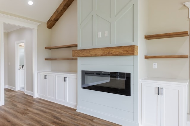4856 Brown Cat Cir, Hahira, GA 31632 - detailed view of wood finished floors, a glass covered fireplace, beamed ceiling, and recessed lighting