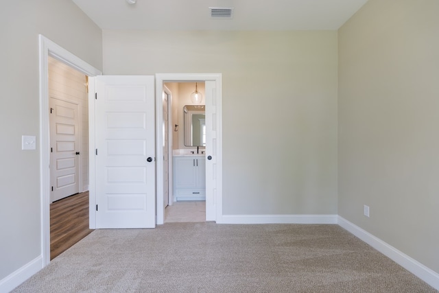 4856 Brown Cat Cir, Hahira, GA 31632 - unfurnished bedroom featuring carpet flooring and ensuite bathroom