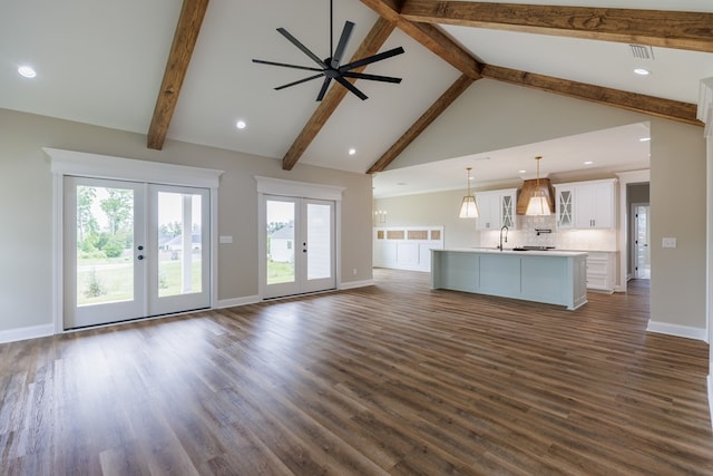 4856 Brown Cat Cir, Hahira, GA 31632 - unfurnished living room with french doors, high vaulted ceiling, beam ceiling, healthy amount of natural light, and dark wood-type flooring