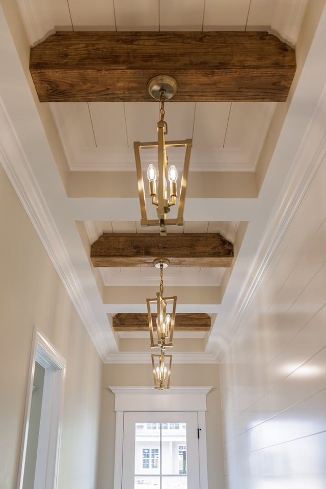 4856 Brown Cat Cir, Hahira, GA 31632 - detailed view of a chandelier, beam ceiling, and crown molding