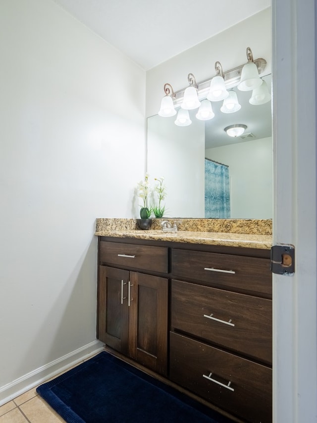 bathroom with vanity and tile patterned flooring