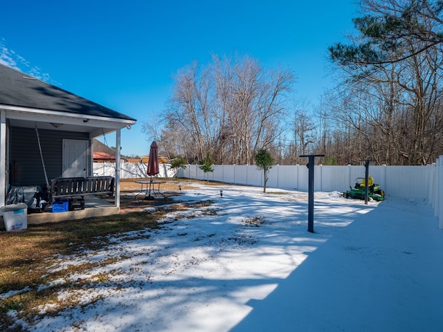 view of yard covered in snow