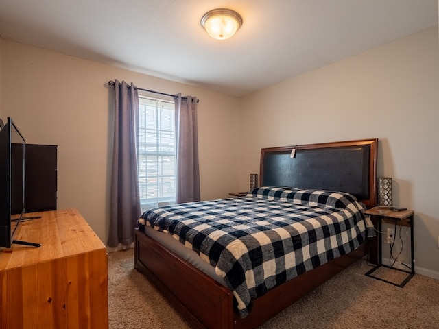 bedroom featuring light colored carpet